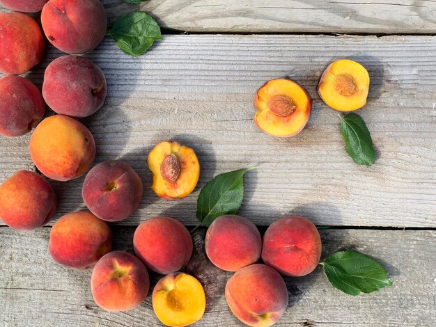 fresh peaches on wooden background