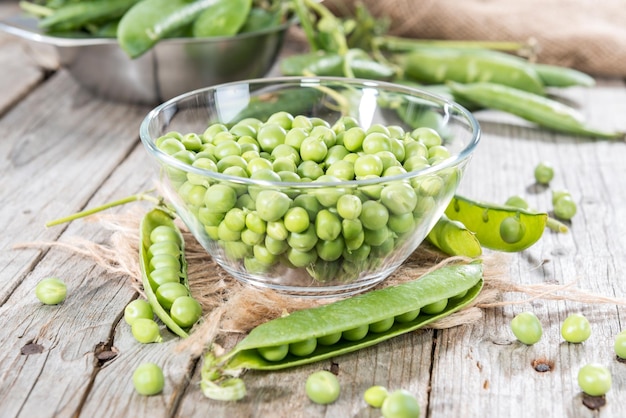 Fresh Peas on wooden background