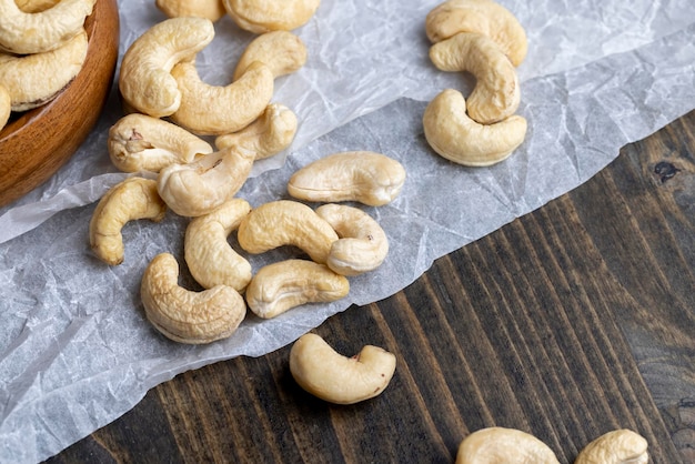 Fresh peeled cashew nuts on the table delicious cashew nuts on a wooden surface