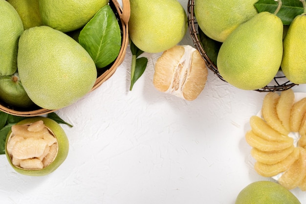 Fresh peeled pomelo on table