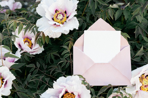 Fresh peonies in the garden Wedding invitation mock up