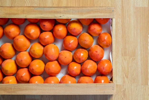 fresh persimmon wooden crate top view b