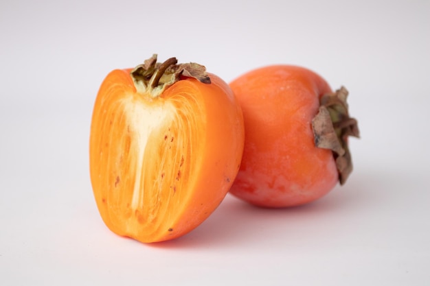 Fresh persimmons isolated on white background