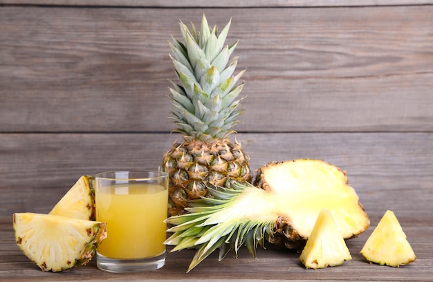 Fresh pineapple juice in the glass with slices