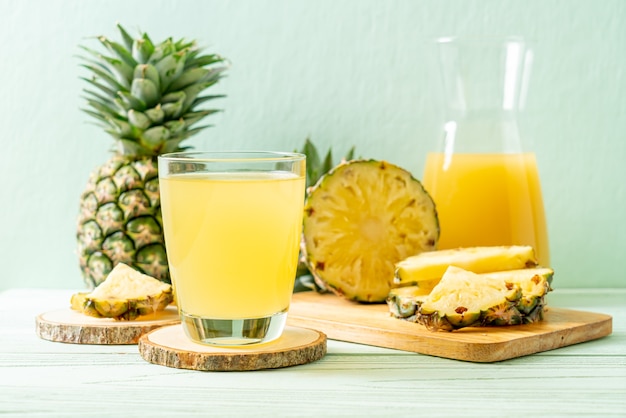 fresh pineapple juice on wooden table