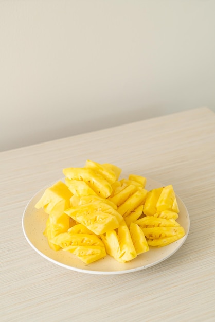 Fresh pineapple sliced on plate