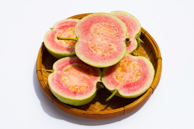 Fresh pink guava on white background