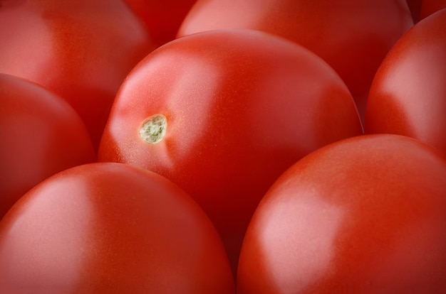 Fresh plum tomatoes horizontal background