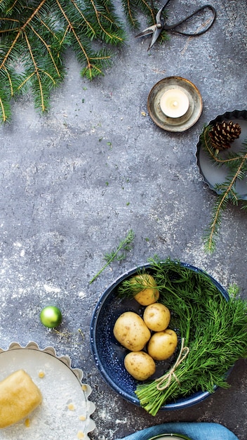 Fresh potatoes and pie dough in the kitchen