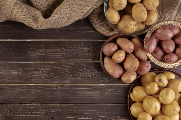 Fresh potatoes on the wood