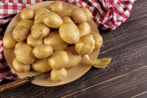 Fresh potatoes on the wood