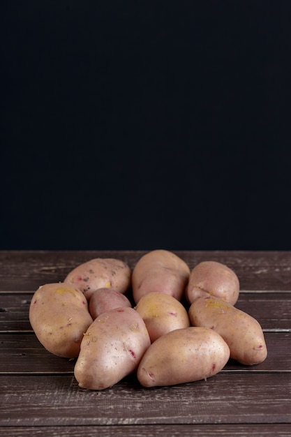 Fresh potatoes on the wood