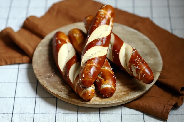 Fresh pretzels on a wooden tray Straight flat pretzels