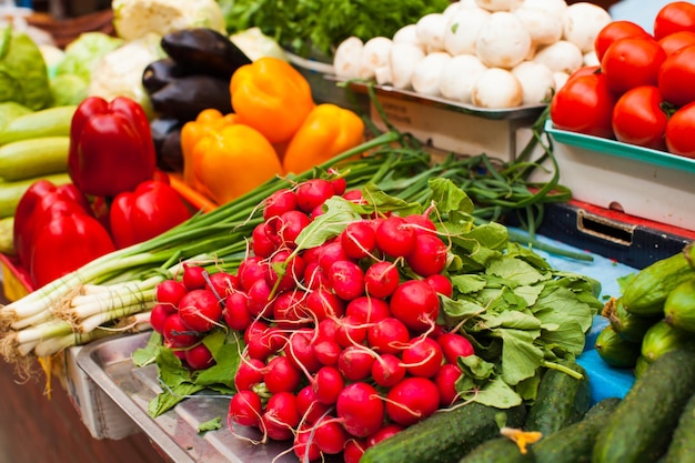 Fresh radish on the oudoor market. Vegetable on a market in Europe