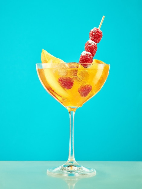 Fresh raspberry coctail on the blue restaurant table