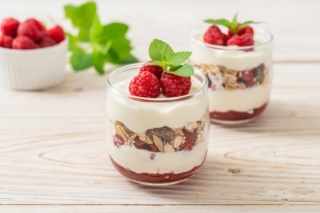 Fresh raspberry and yogurt with granola - Healthy food style