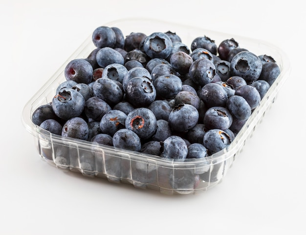 Fresh and raw blueberries with drops of water