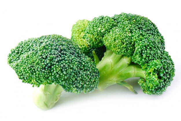 Fresh raw broccoli on a white background, side view. 