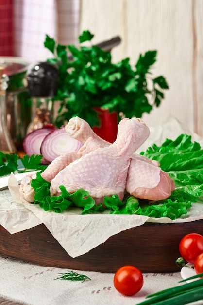 Fresh raw chicken drumsticks on the table