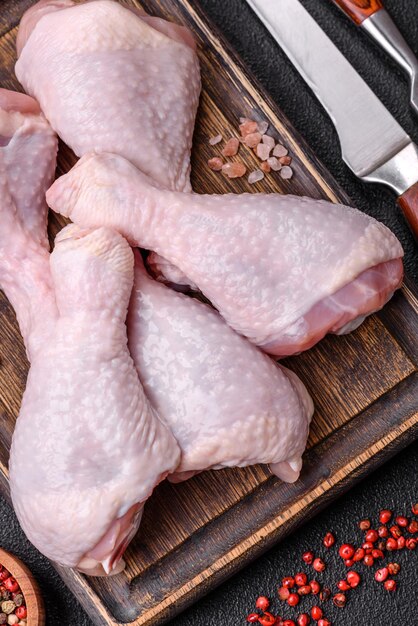 Fresh raw chicken legs with salt and spices