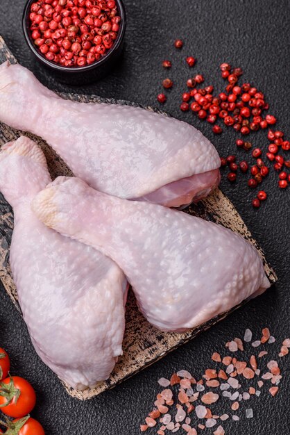 Fresh raw chicken legs with salt and spices