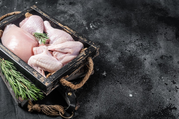 Photo fresh raw chicken meat and chicken parts drumstick breast fillet wing thigh black background top view copy space