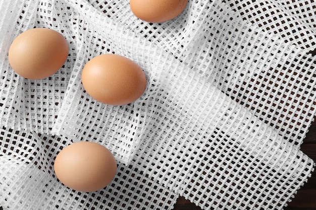 Fresh raw eggs on napkin