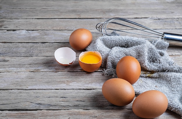 Fresh raw eggs on a wooden table