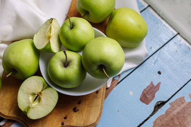 Fresh raw green apples on the wooden background Healthy food Juicy fruits for all