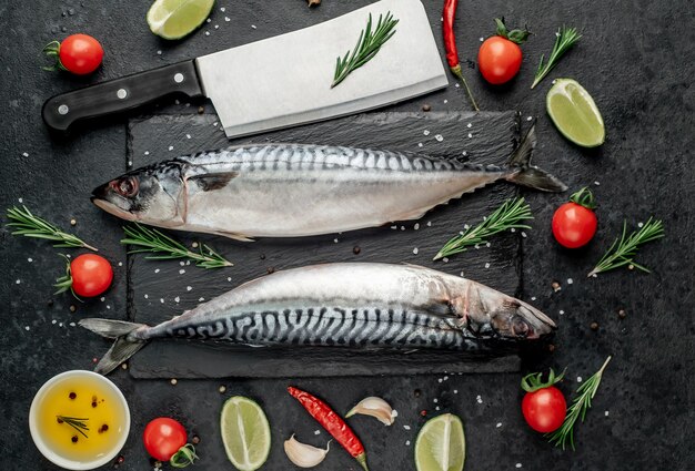 Fresh raw mackerel fish on stone background