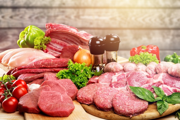 Fresh Raw Meat Background with vegetables, meat concept, butcher's shop.