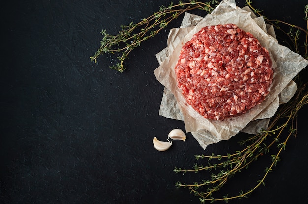 Fresh raw minced meat on baking sheets