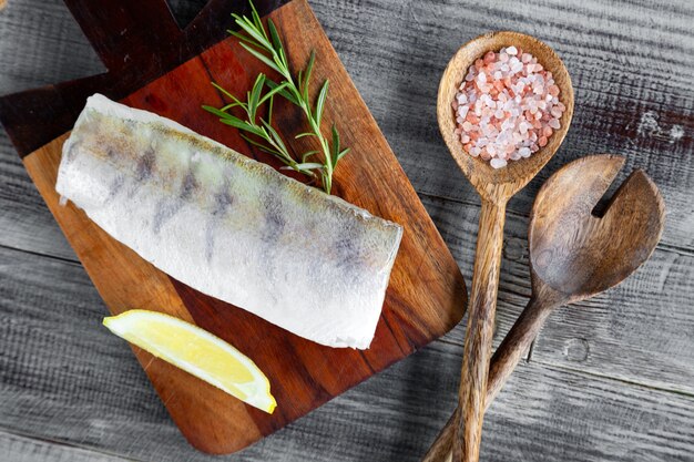 Fresh raw pike perch fish fillet on cutting board