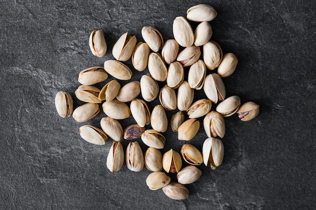 Fresh raw Pistachios isolated on dark background High ewsolution image