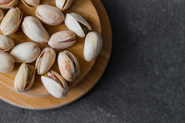 Fresh raw Pistachios isolated on dark background High ewsolution image