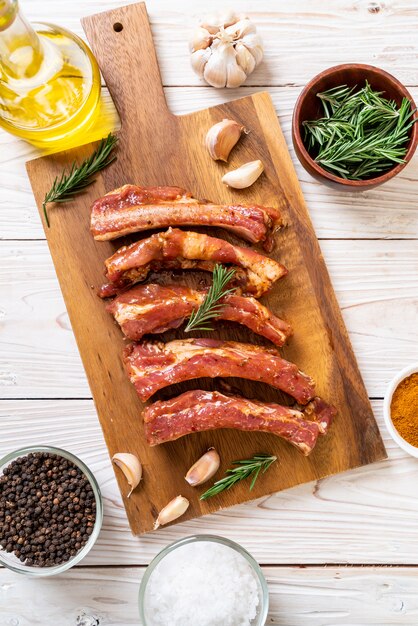 Fresh raw pork ribs ready for roasting with ingredients