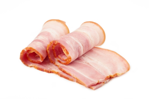 Fresh raw slices bacon isolated on white background. Roll of bacon. Top view