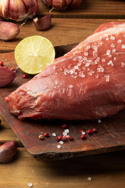 Fresh raw tenderloin steak with spices. selective focus