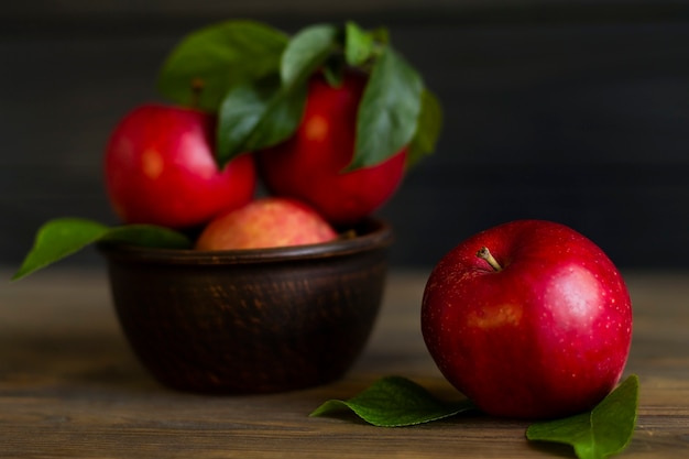 Fresh red apples, on a wooden table.