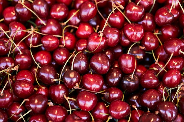 Fresh red cherries background. Texture cherry berries