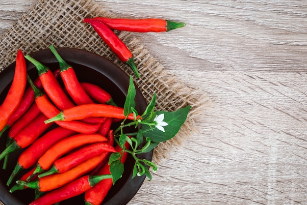 Fresh red chilli pepper on table