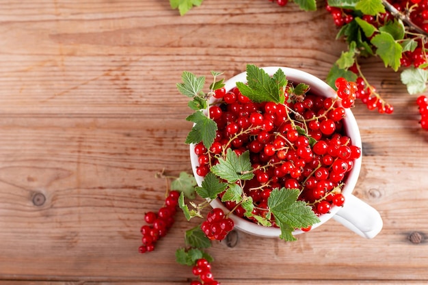 Fresh red currant on table Top view Copy space