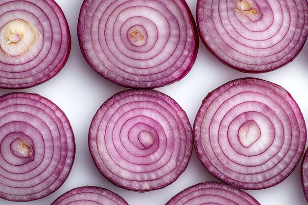 Photo fresh red onion with sliced onion rings on a white background showcasing vibrant layers organic