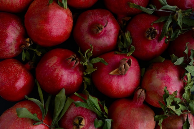 Fresh red ripe pomegranates Juicy and tasty pomegranate fruits background