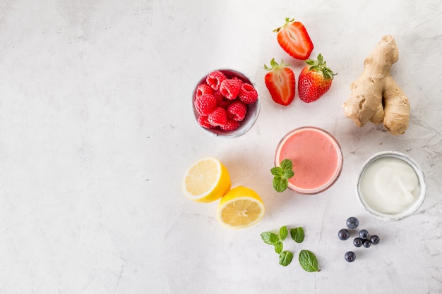 Fresh red smoothie with ingredients