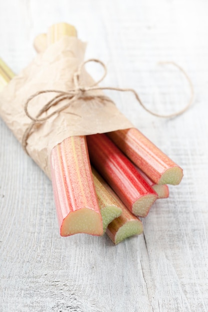 Fresh rhubarb on wooden table