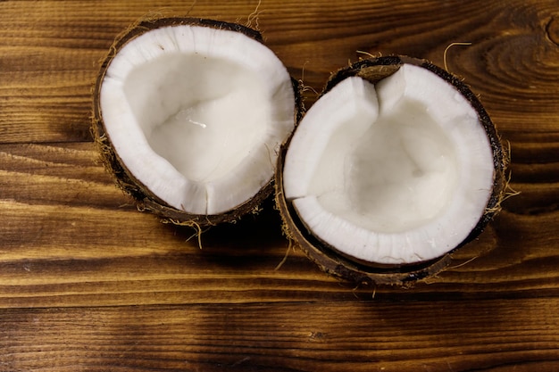 Fresh ripe coconut on rustic wooden table