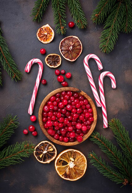 Fresh ripe cranberry in wooden bowl