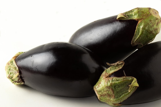 Fresh and ripe eggplants close up