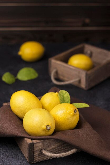 fresh ripe lemons in wooden box